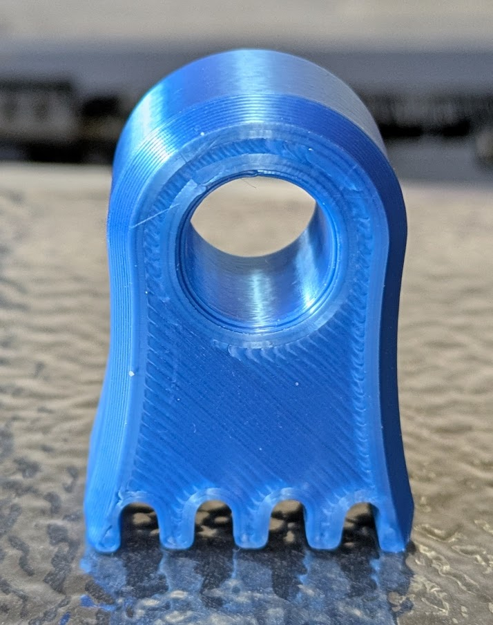 A blue 3D-printed device which bears a striking resemblance to the ghosts in Pac-Man after the protagonist eats one of the big dots.